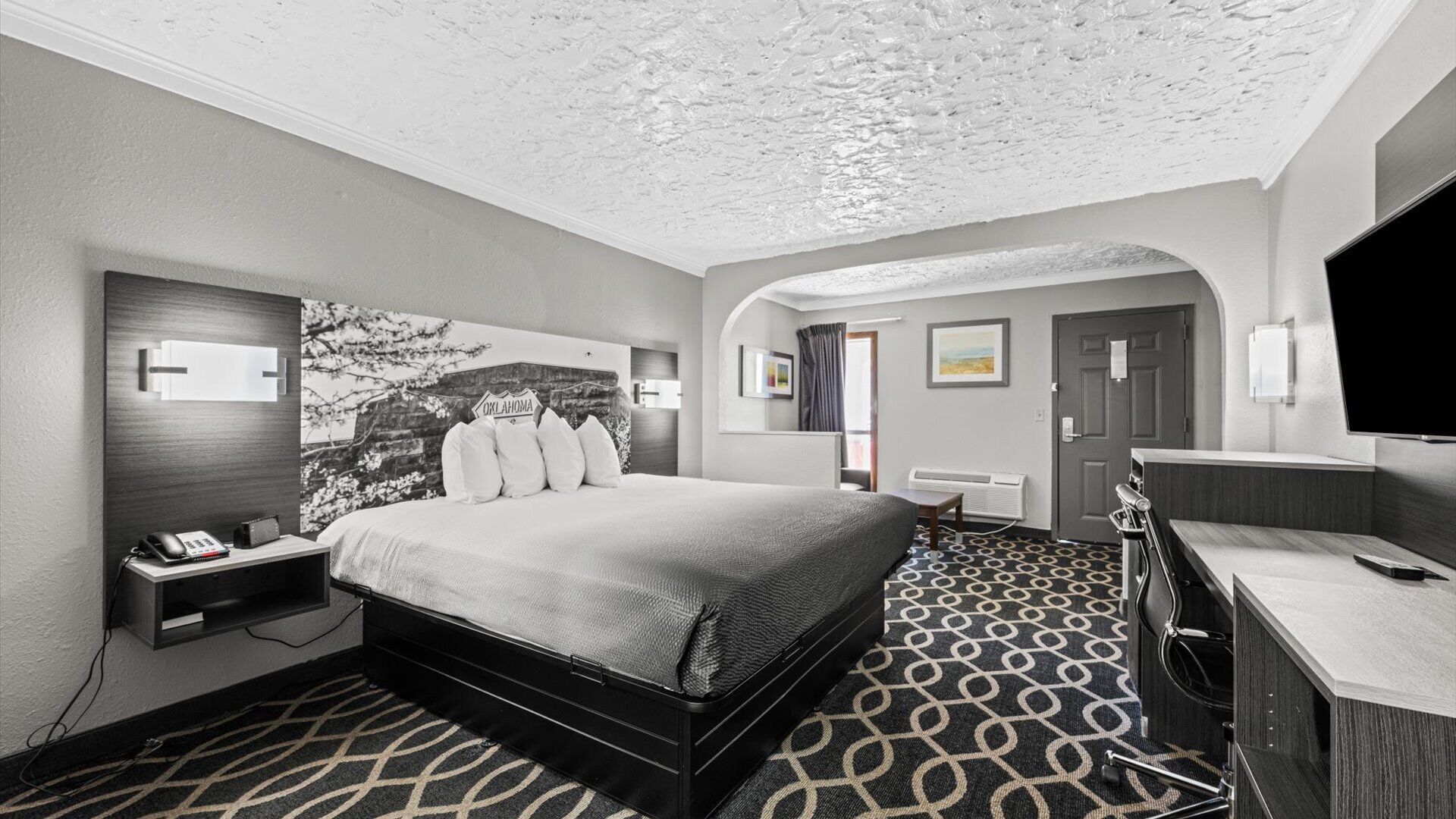 Suite, 1 King Bed, Non Smoking | Desk, laptop workspace, blackout drapes, iron/ironing board
