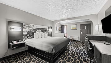 Suite, 1 King Bed, Non Smoking | Desk, laptop workspace, blackout drapes, iron/ironing board