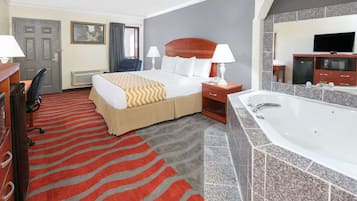 Deluxe Suite, 1 King Bed, Non Smoking | Desk, laptop workspace, blackout curtains, iron/ironing board
