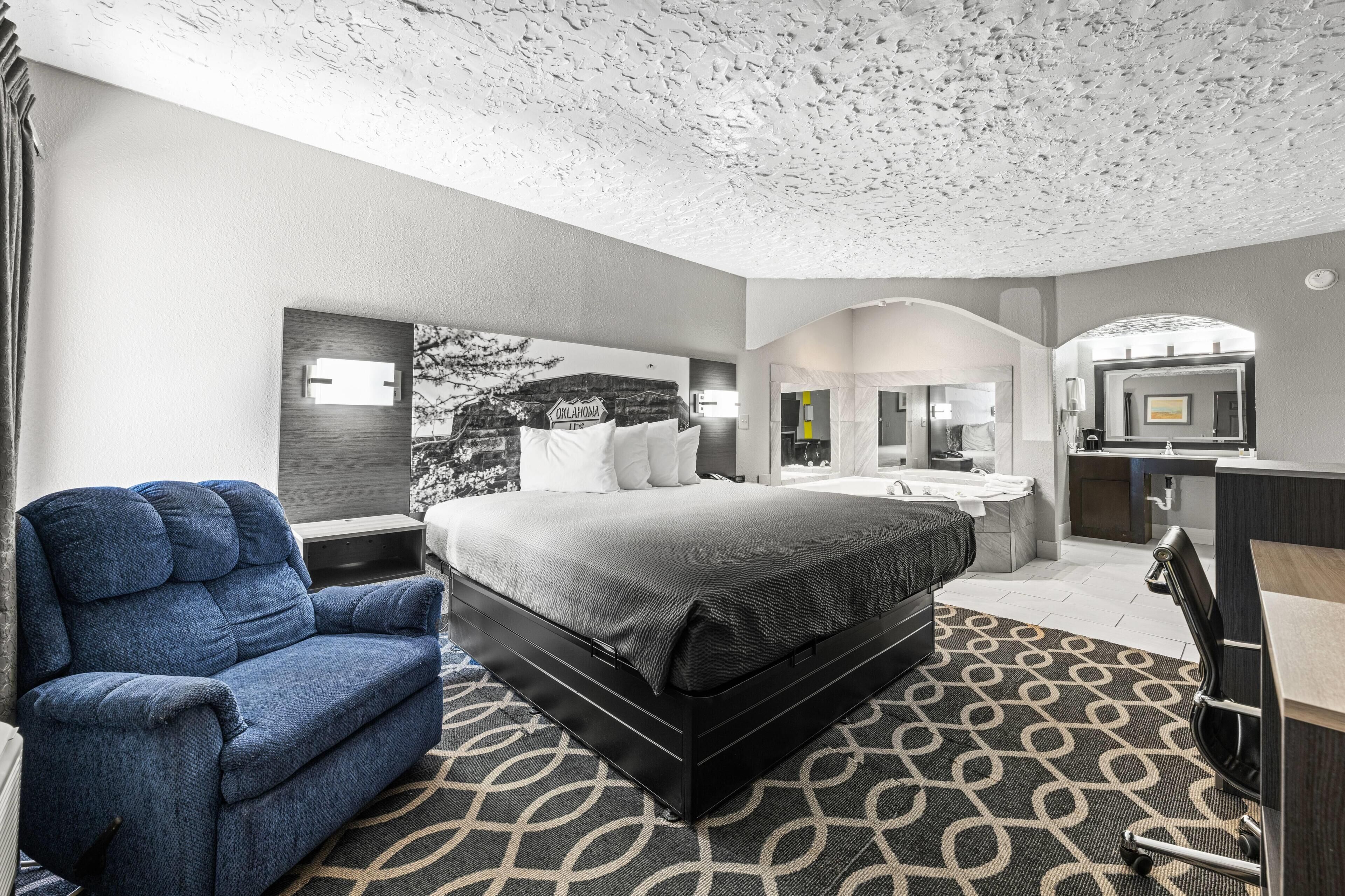 Deluxe Suite, 1 King Bed, Non Smoking | Desk, laptop workspace, blackout drapes, iron/ironing board