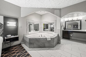 Deluxe Suite, 1 King Bed, Non Smoking | Desk, laptop workspace, blackout drapes, iron/ironing board