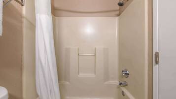 A bathroom with a bathtub, a shower, and a toilet.