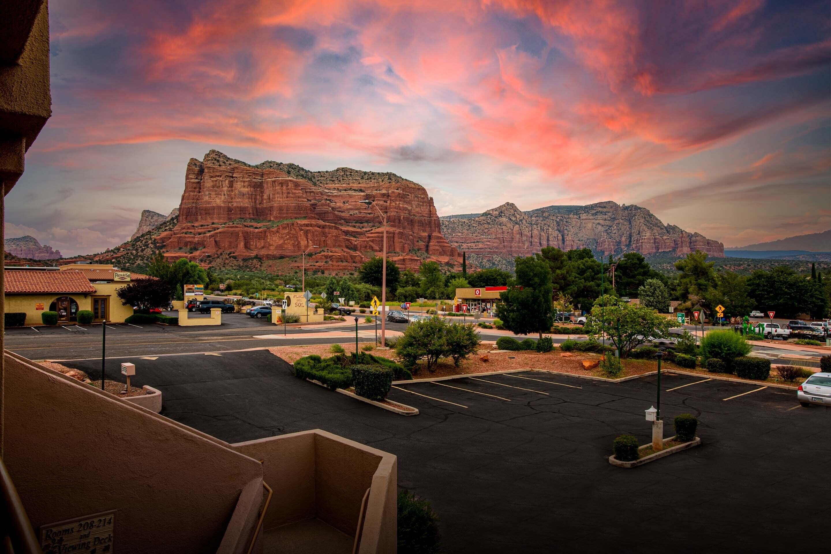 A parking lot with a mountain in the background.