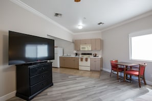 Cozy Kitchenette King Suite | Pillowtop beds, blackout drapes, iron/ironing board, free WiFi