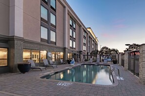 Outdoor pool, open 10:00 AM to 10:00 PM, pool loungers