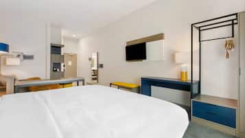 Suite, Non Smoking (1 King Bed, 1 Double Bed) | Desk, laptop workspace, blackout curtains, iron/ironing board