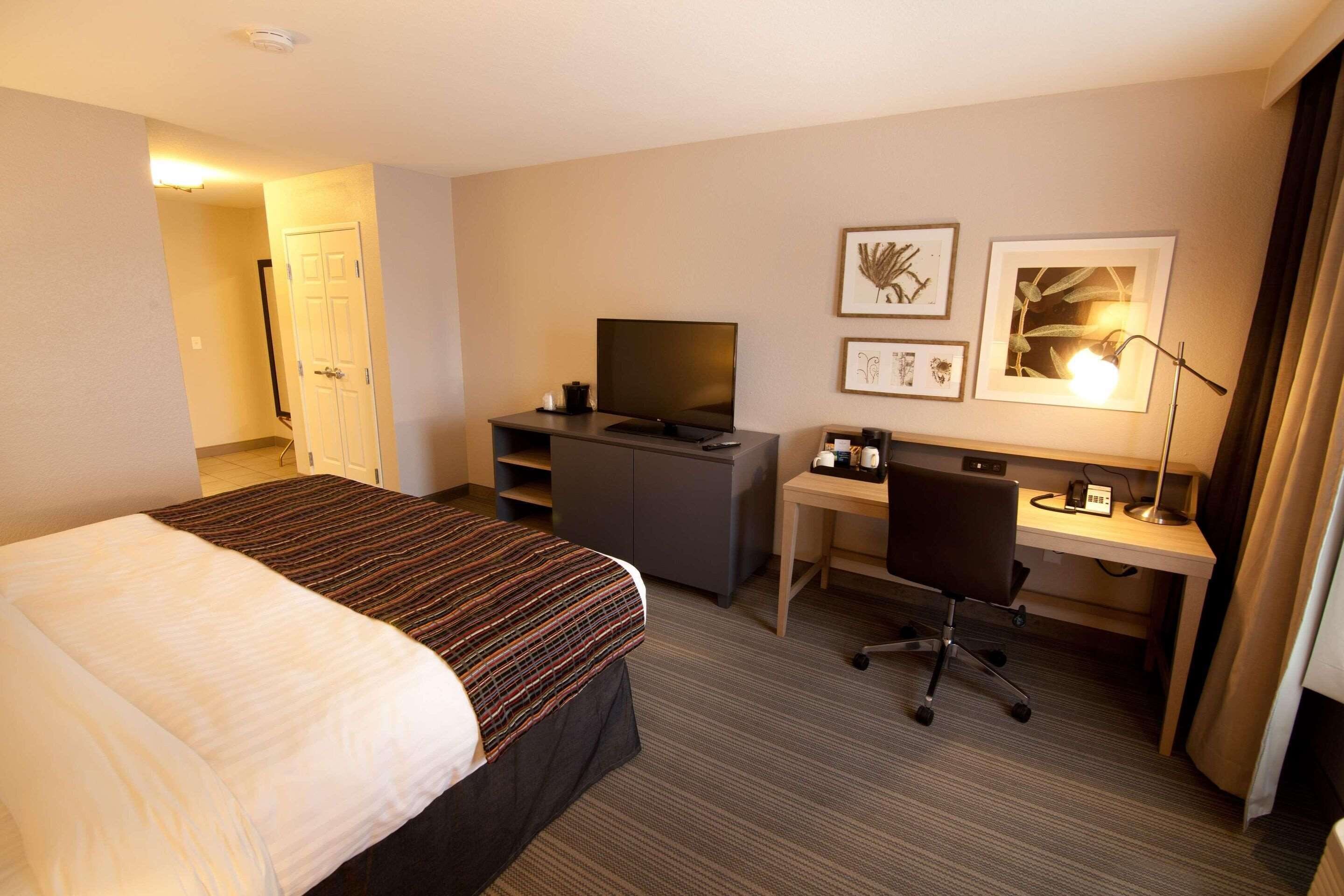 premium bedding, desk, blackout curtains, iron/ironing board