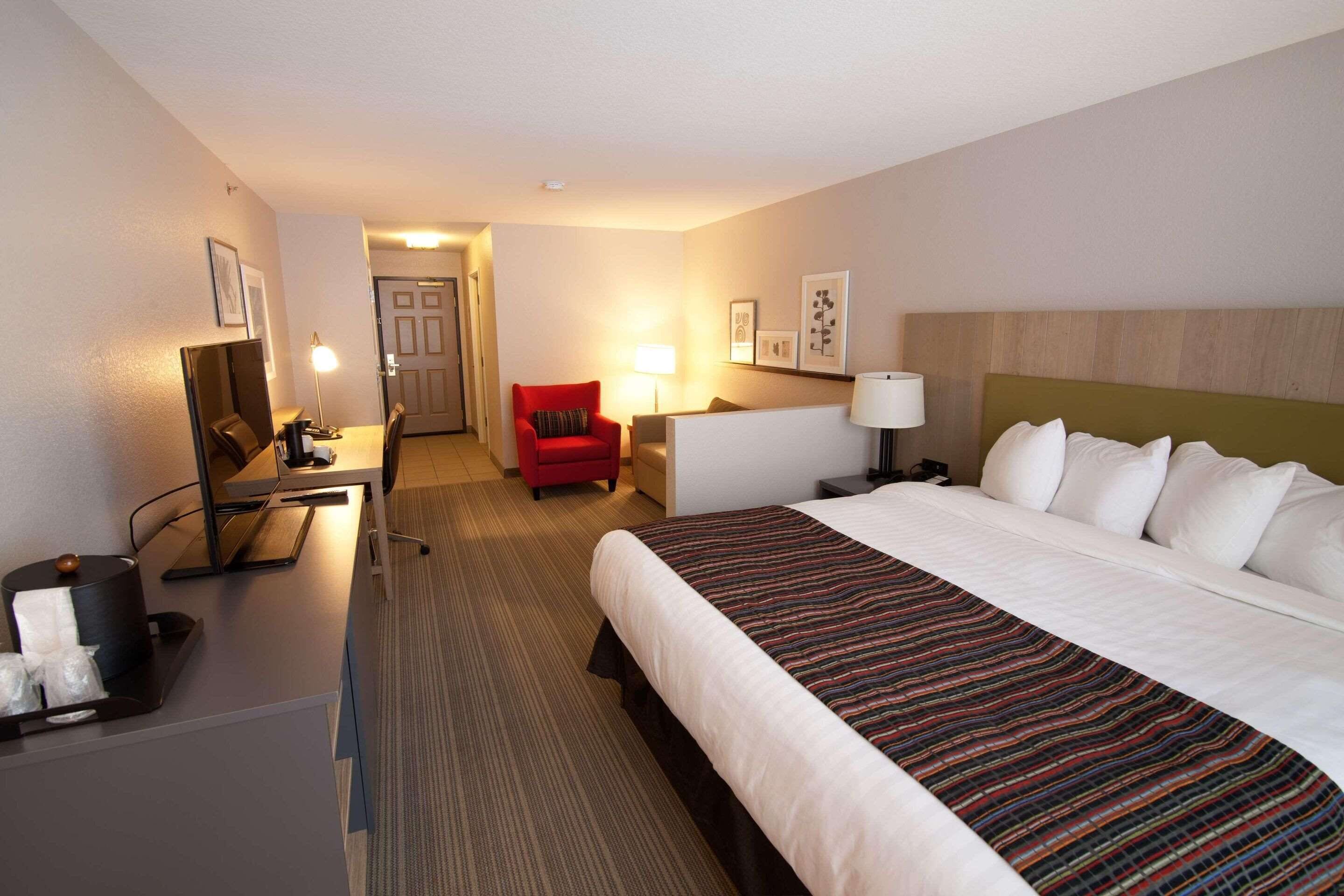 premium bedding, desk, blackout curtains, iron/ironing board