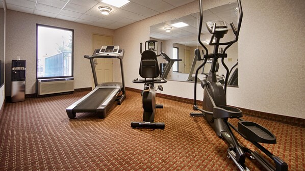A hotel fitness room with a treadmill, elliptical, and stationary bike. - Baymont by Wyndham Franklin (Franklin)