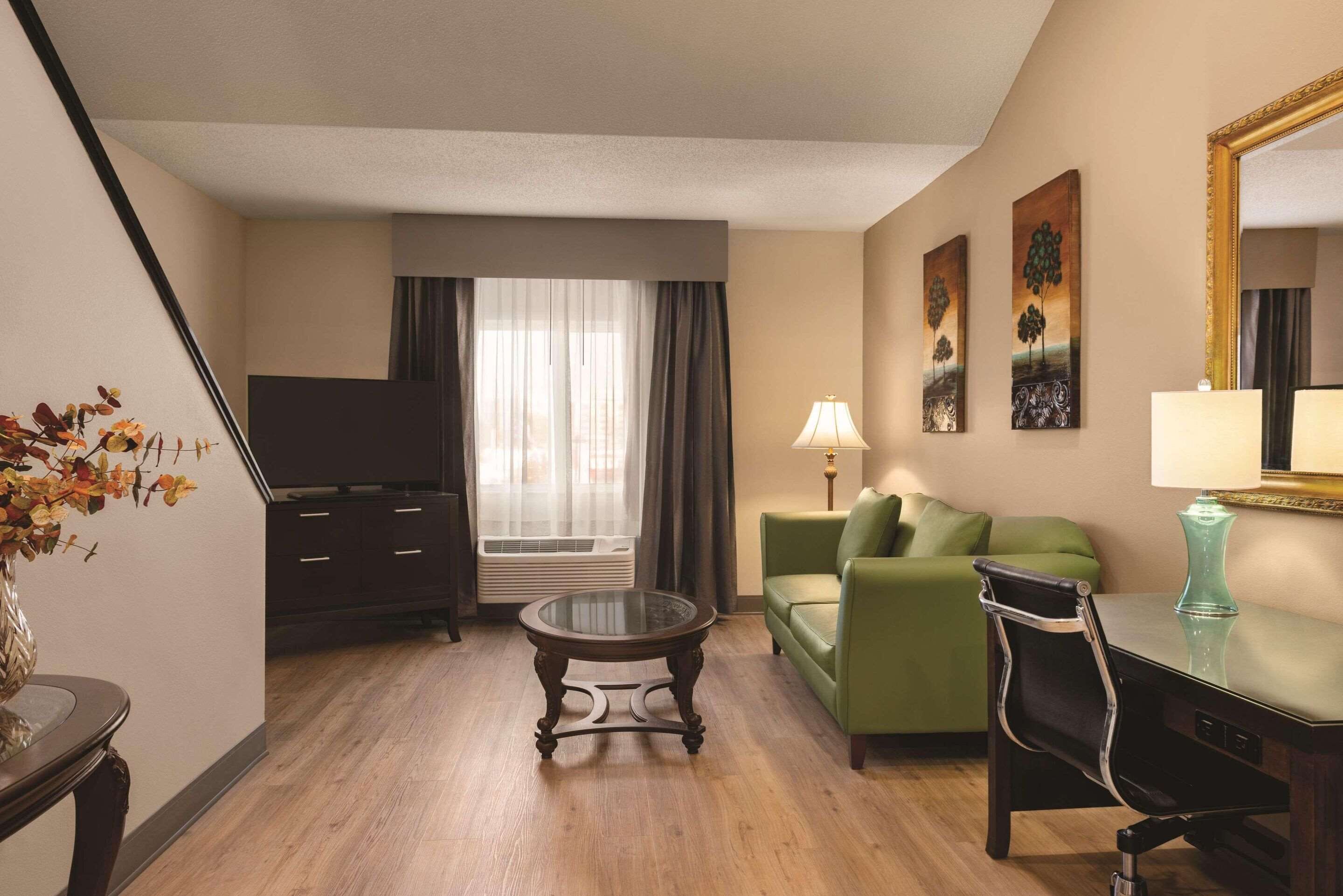 premium suite, 1 king bed, non smoking, jetted tub | 1 bedroom, desk, iron/ironing board, free cots/infant beds