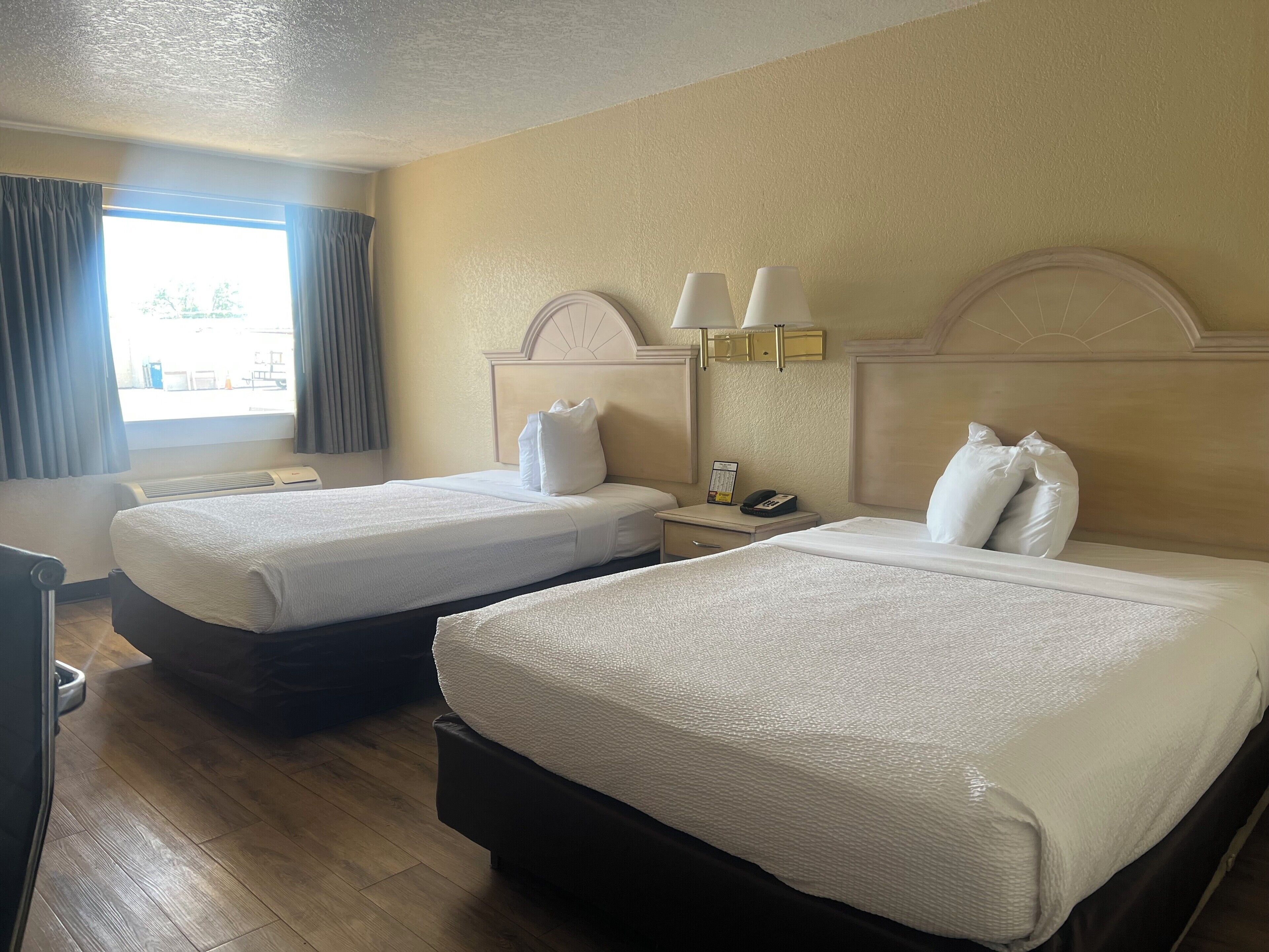 2 Queen Beds, Non-Smoking, Refrigerator, Microwave | Blackout drapes, soundproofing, free WiFi, bed sheets