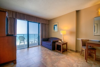 Suite, Oceanfront | In-room safe, blackout drapes, iron/ironing board, bed sheets at Ocean Drive Beach & Golf Resort