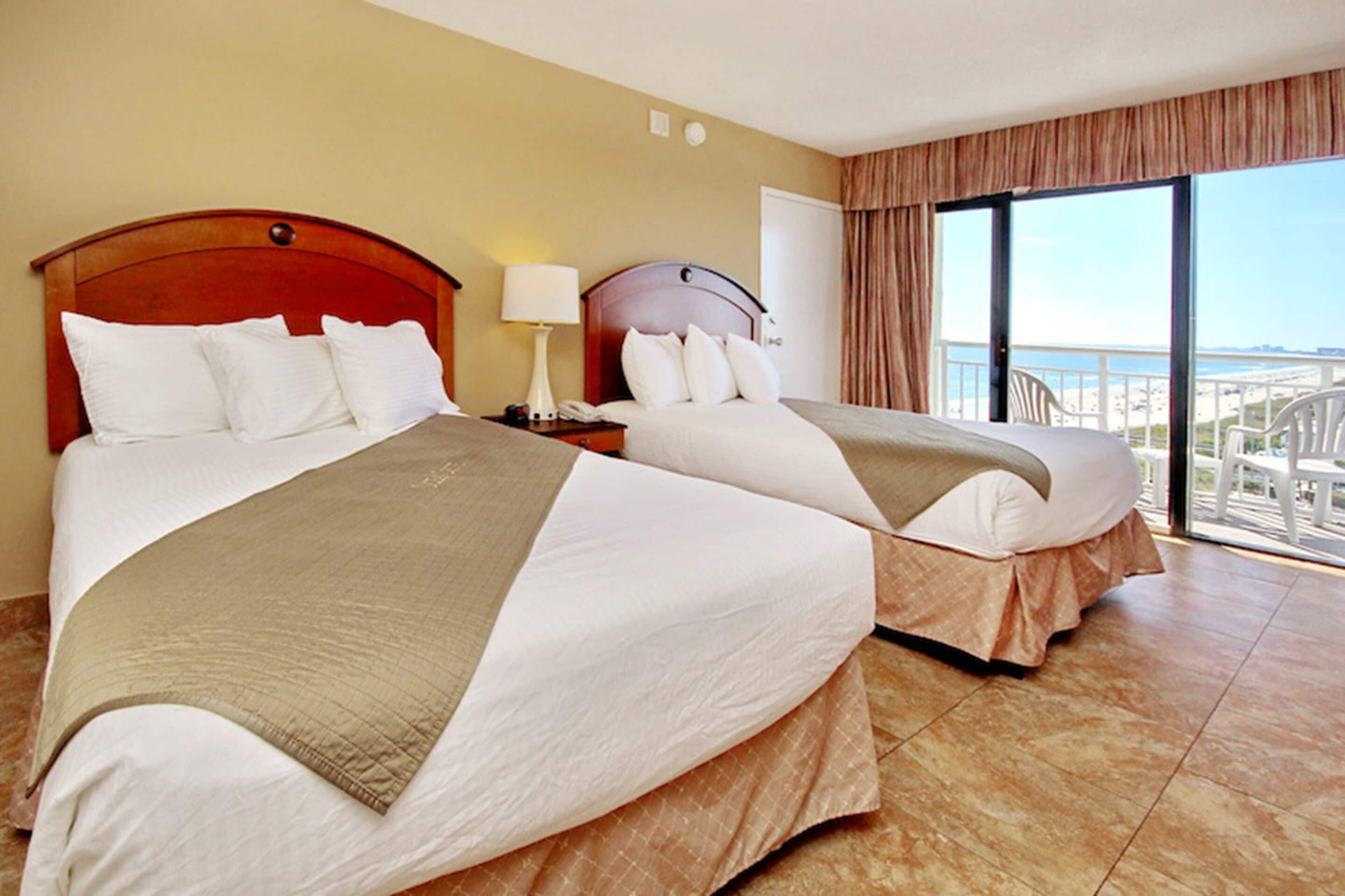 standard room, 2 double beds, partial sea view | in-room safe, blackout curtains, iron/ironing board, bed sheets