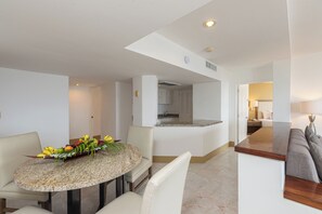 A modern kitchen with white cabinets, a granite countertop, and a built-in oven. - Tesoro Ixtapa All Inclusive (Ixtapa)