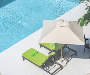 Outdoor pool, pool umbrellas, sun loungers