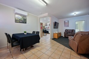 Room, Multiple Beds, Non Smoking | Living area | LCD TV