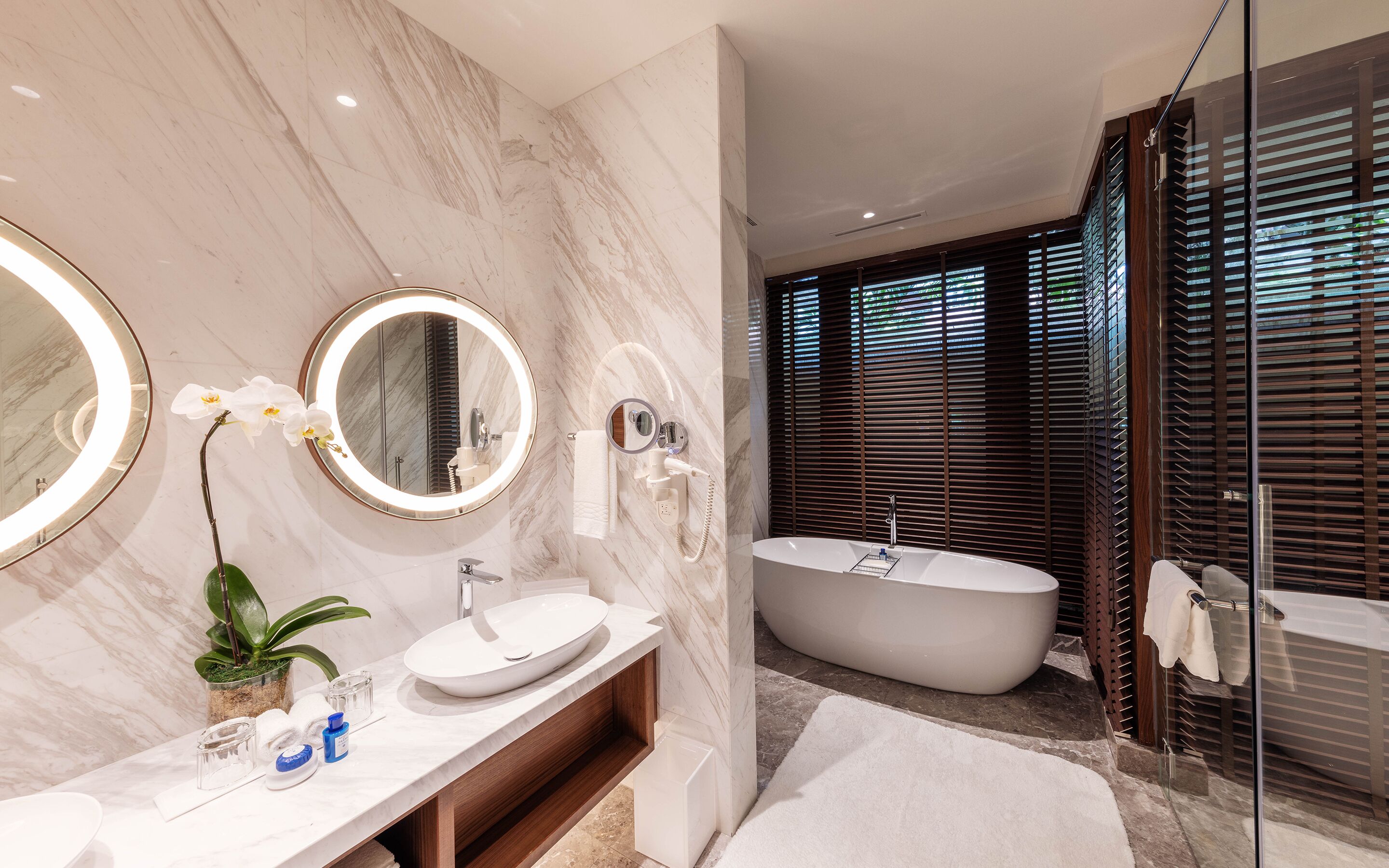 one-bedroom pool villa | bathroom | designer toiletries, hair dryer, slippers, towels