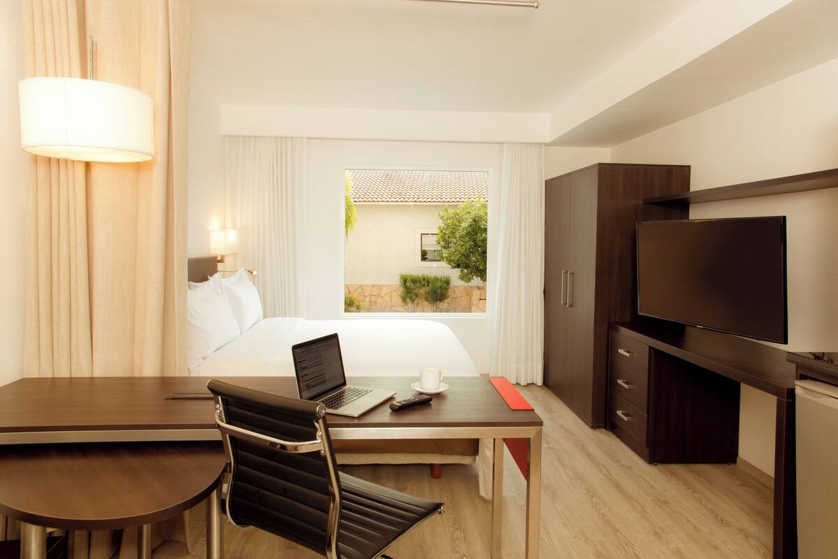 in-room safe, desk, blackout curtains, iron/ironing board