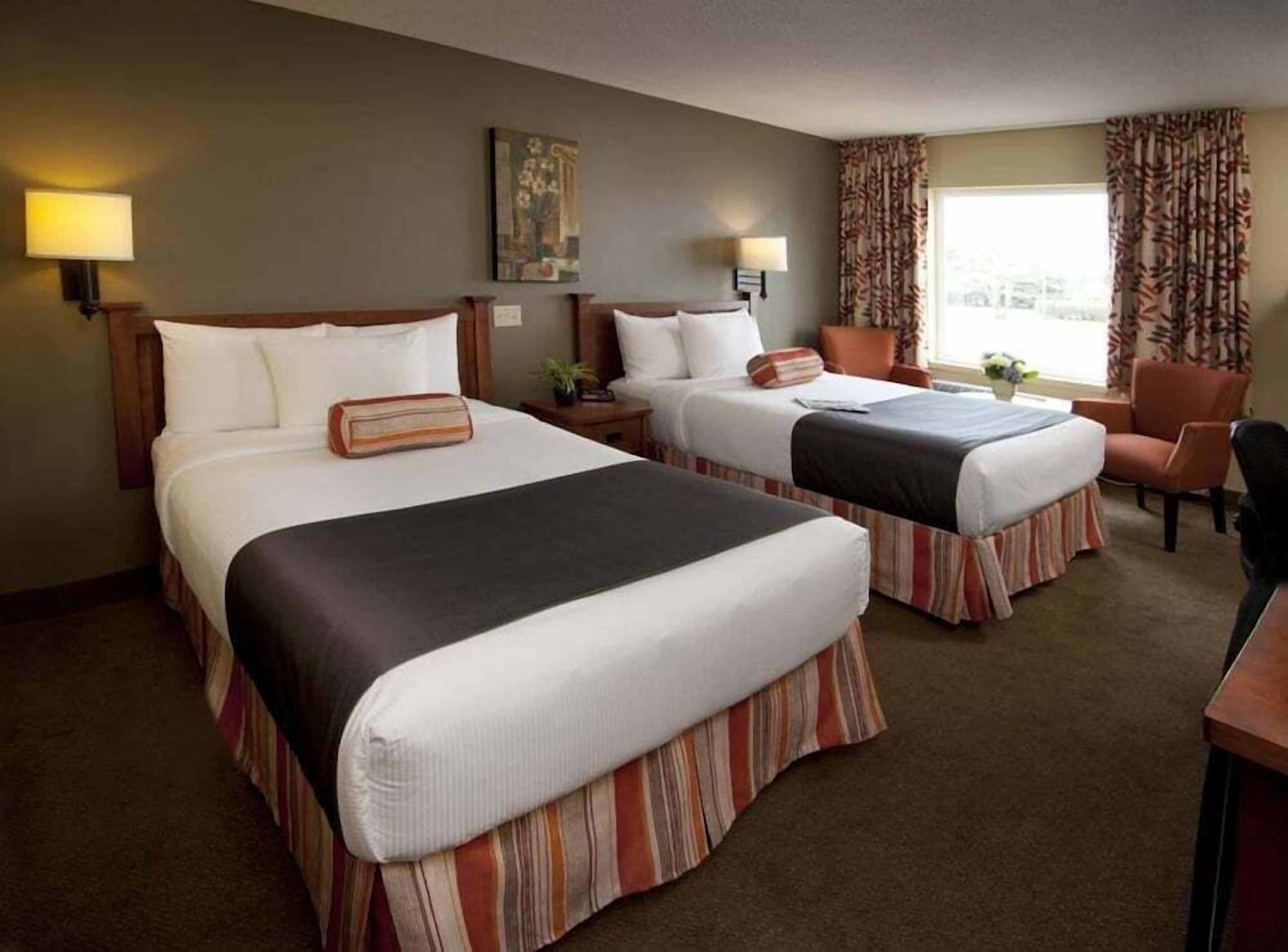 Premium bedding, pillow-top beds, desk, blackout curtains