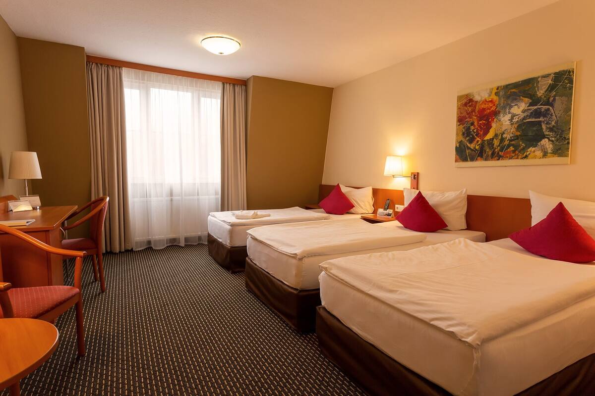 Standard Triple Room | Desk, laptop workspace, blackout drapes, soundproofing