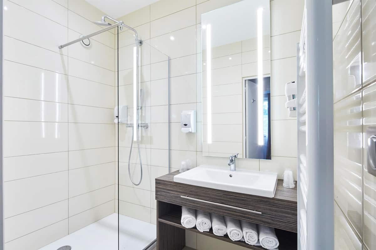 shower, eco-friendly toiletries, hair dryer, towels