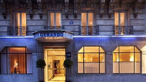 The exterior of the Gerando Hotel with a classic facade, large windows, and a prominent entrance. - Hotel Gérando (Paris)