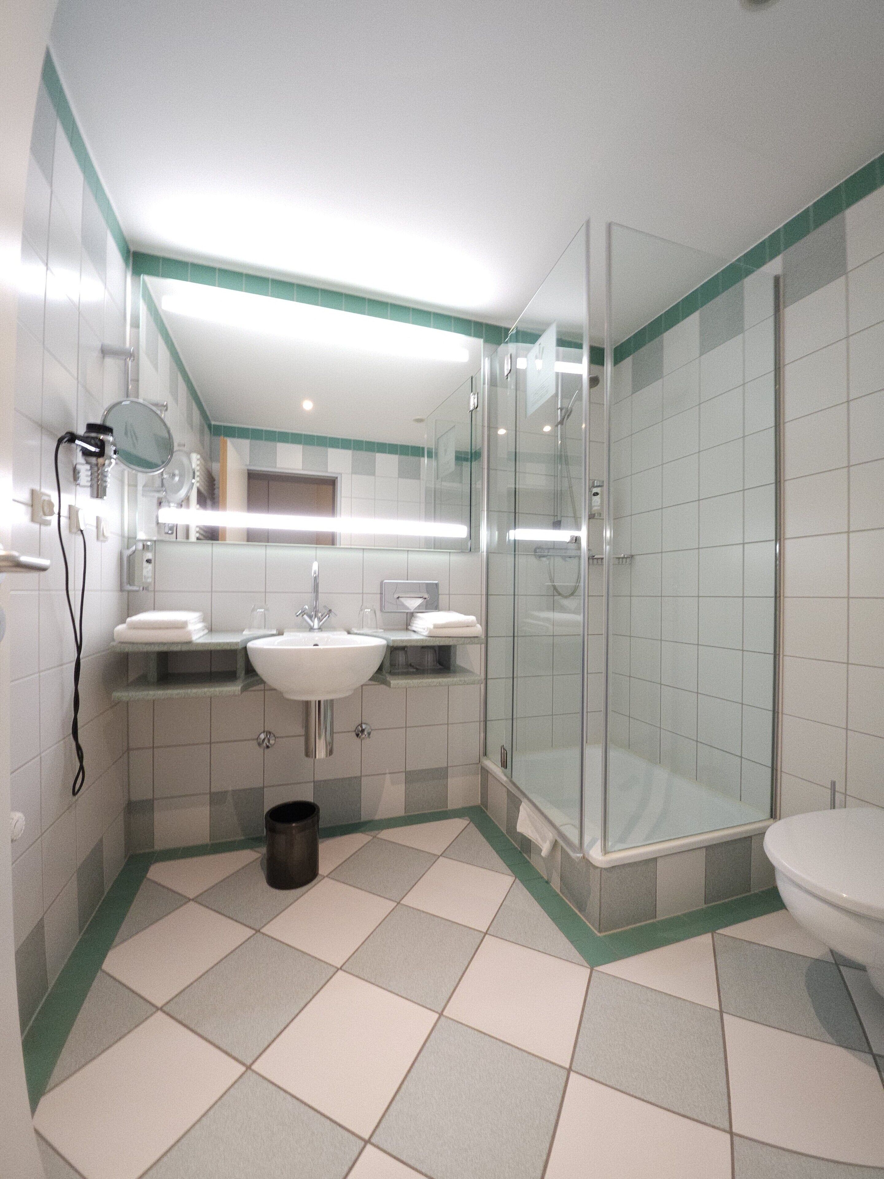 shower, free toiletries, hair dryer, slippers