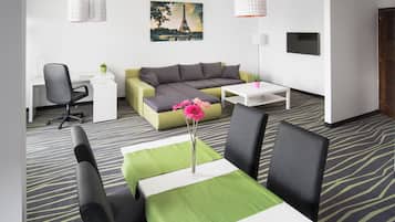 Deluxe Apartment | Living area | 82-cm LCD TV with cable channels, TV
