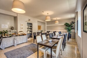 Enjoy a warm and inviting dining experience with a beautifully set table and elegant decor.