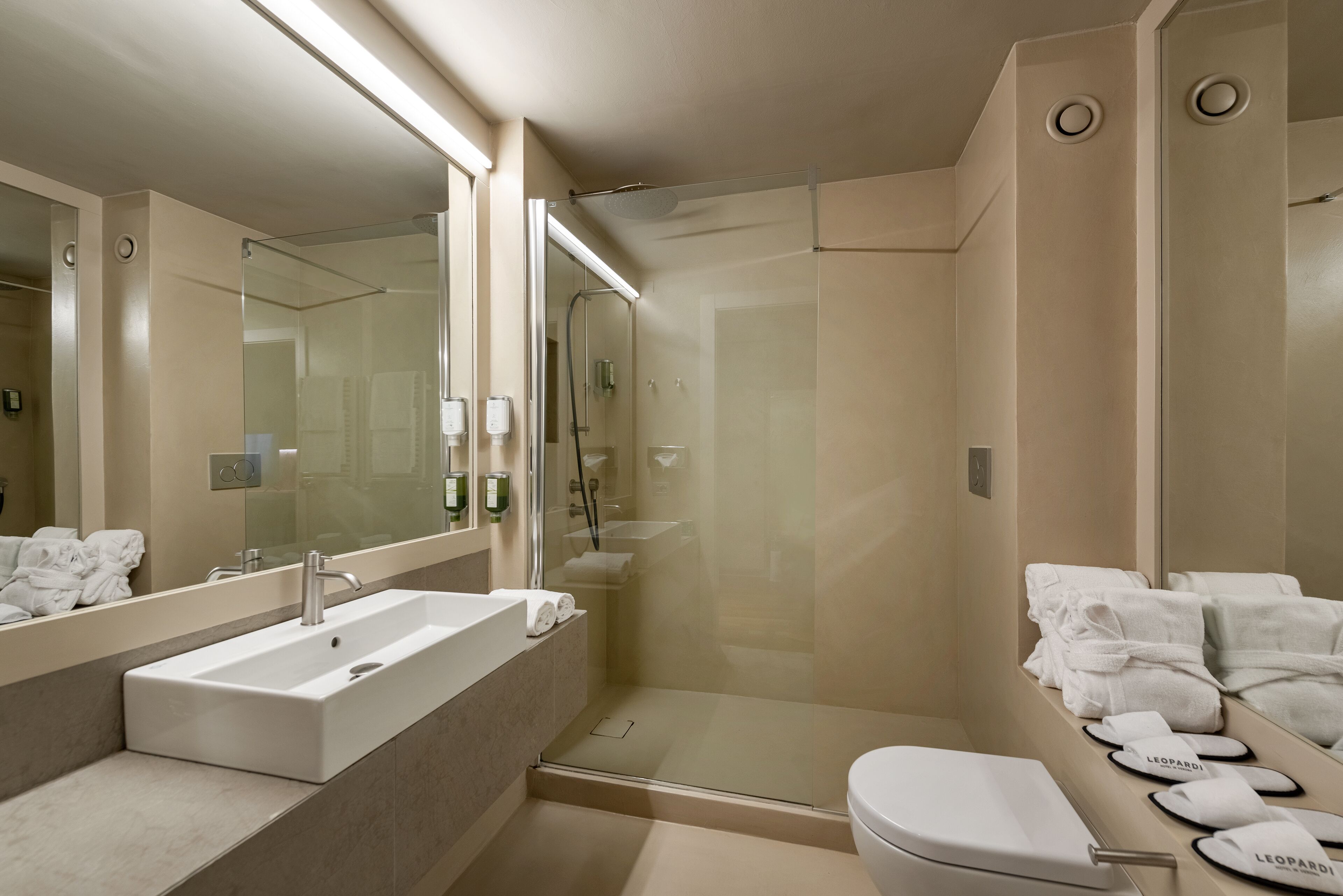 junior suite (shower) | bathroom | combined shower/bathtub, hair dryer, bidet, towels