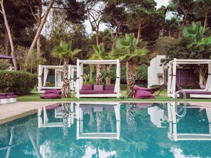 Indoor pool, 2 outdoor pools, open 9:00 AM to 6:00 PM, pool umbrellas