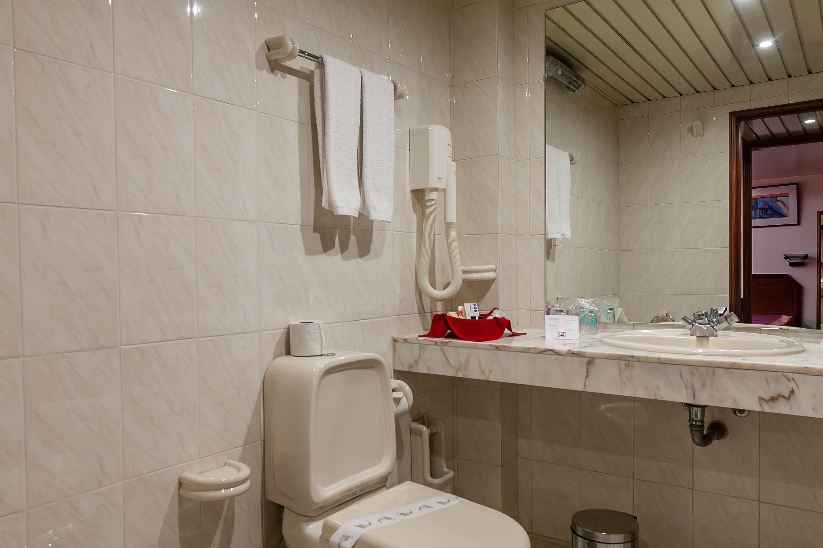 bathtub, hair dryer, towels