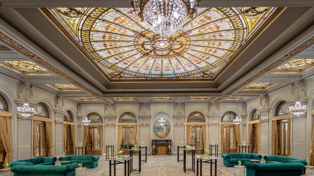 A grand lobby with a high ceiling, ornate chandeliers, and luxurious green sofas. - InterContinental Athénée Palace Bucharest by IHG (Bucharest)