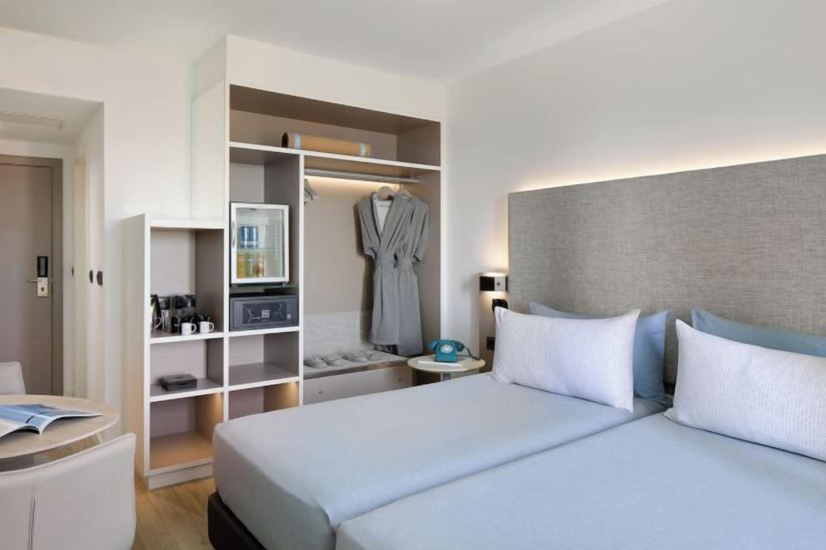 Premium bedding, down comforters, minibar, in-room safe