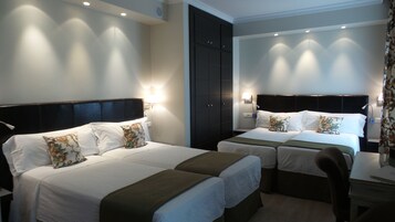 Quadruple Room | Down comforters, in-room safe, desk, blackout drapes