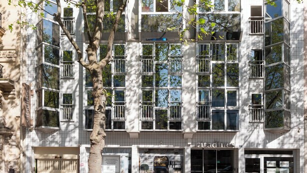 A multi-story building with a modern architectural style, featuring a mix of glass and metal elements. - Citadines Montparnasse Paris (Paris)