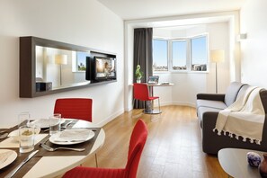 Apartment, 1 Bedroom | Living area | 40-cm TV with cable channels