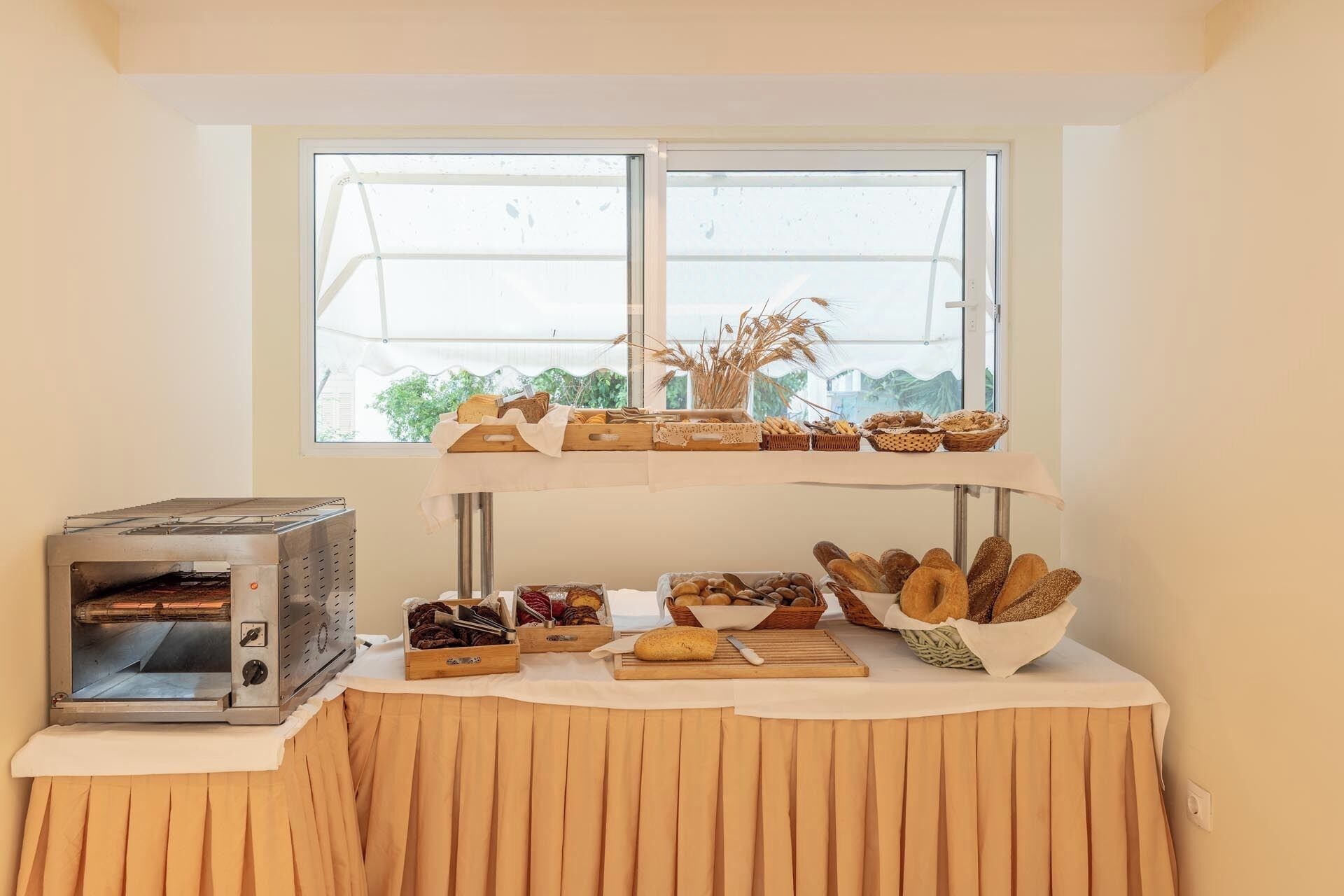 A bakery setup with a bread display and a bread oven.