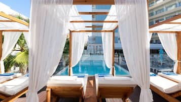 Seasonal outdoor pool, open 8 AM to 8 PM, pool umbrellas, pool loungers