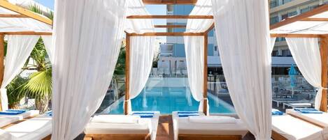 Seasonal outdoor pool, open 8 AM to 8 PM, pool umbrellas, pool loungers