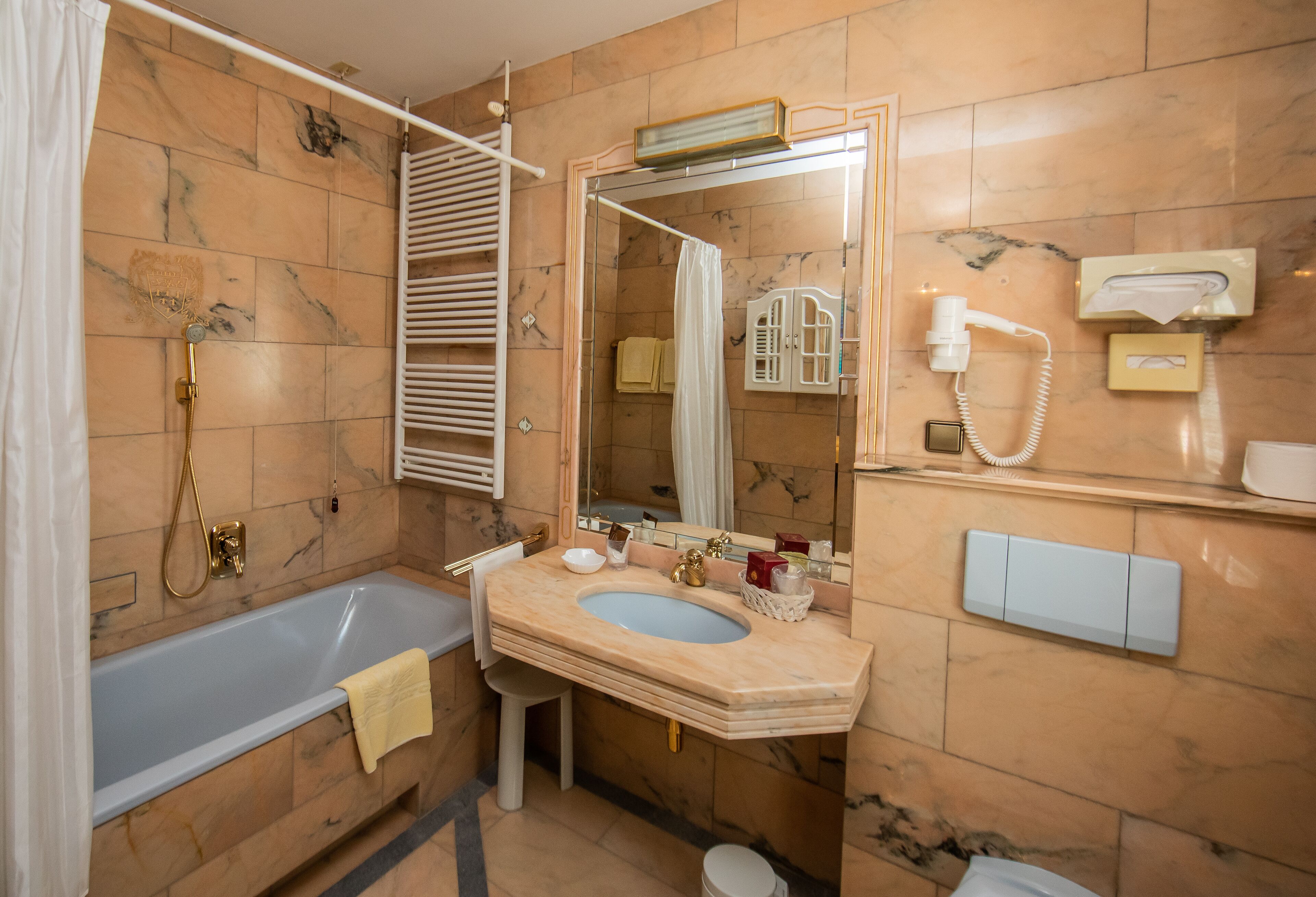 bathtub, free toiletries, hair dryer, slippers