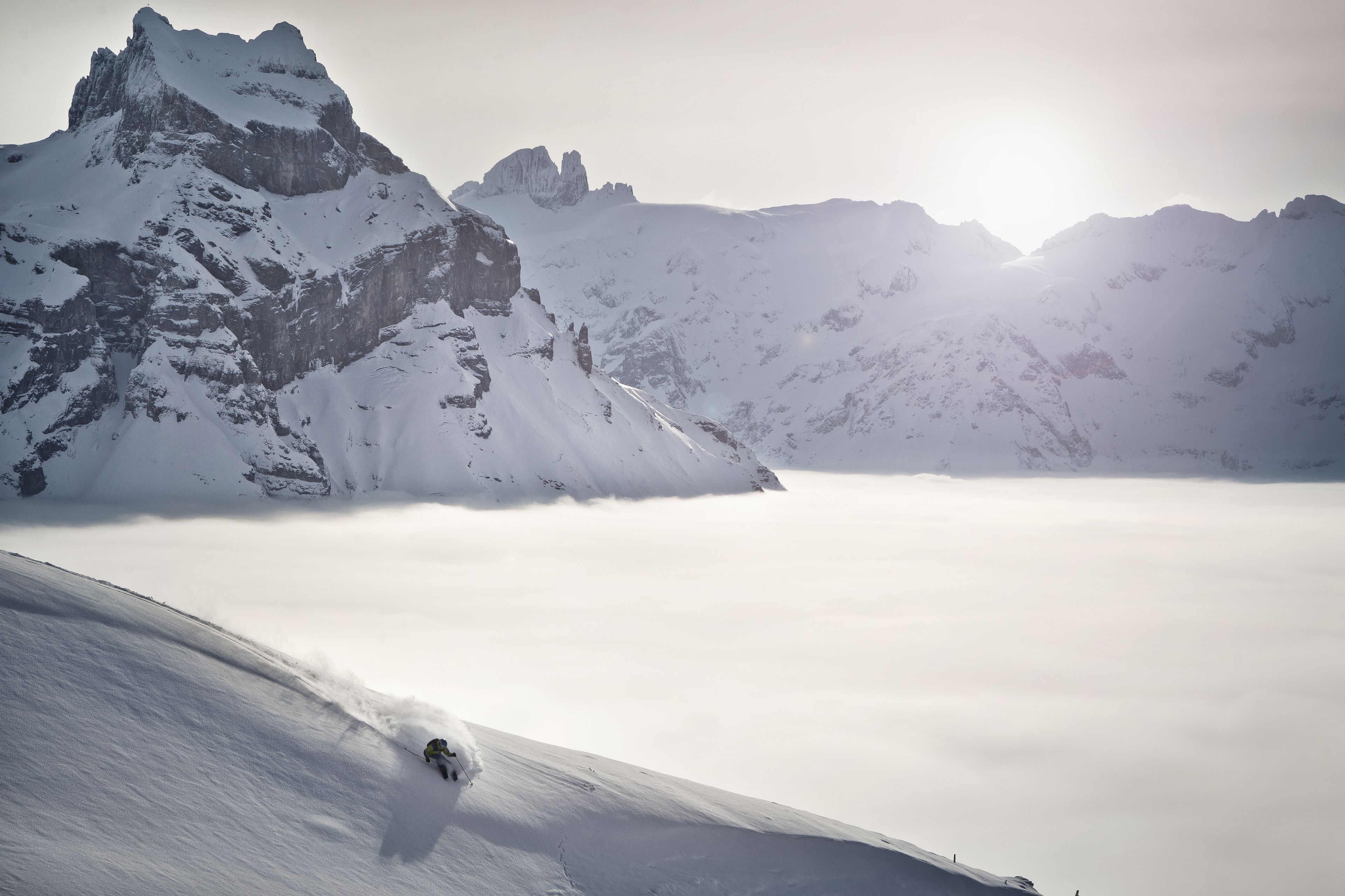 A snow-covered mountain landscape with a clear sky.