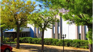 A building with a modern architectural style, surrounded by trees and a well-maintained lawn. - Aix Hotel (Aix-en-Provence)