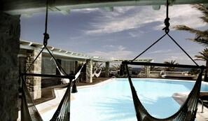 Outdoor pool, free pool cabanas, pool umbrellas