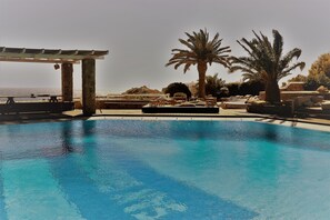Outdoor pool, free pool cabanas, pool umbrellas