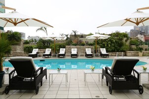 Outdoor pool, pool umbrellas, sun loungers
