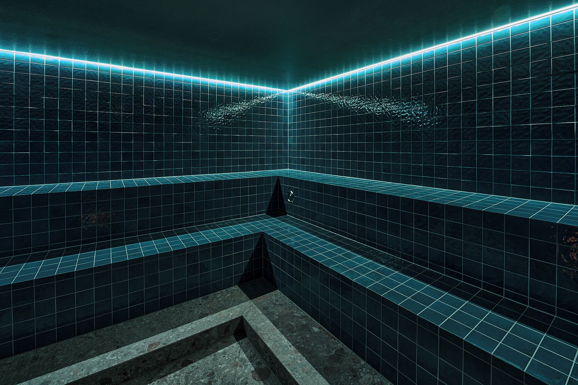A modern bathroom with dark blue tiles, a geometric bench, and a neon light strip along the ceiling.