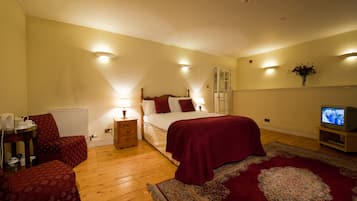 Executive Double Room, 1 King Bed | Living area | 22-inch LCD TV with digital channels, TV, DVD player