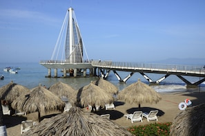 On the beach, sun loungers, beach umbrellas, beach towels