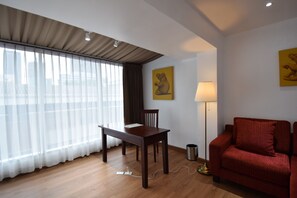 Luxury Suite, 1 King Bed | Living area | 40-inch LED TV with cable channels, TV